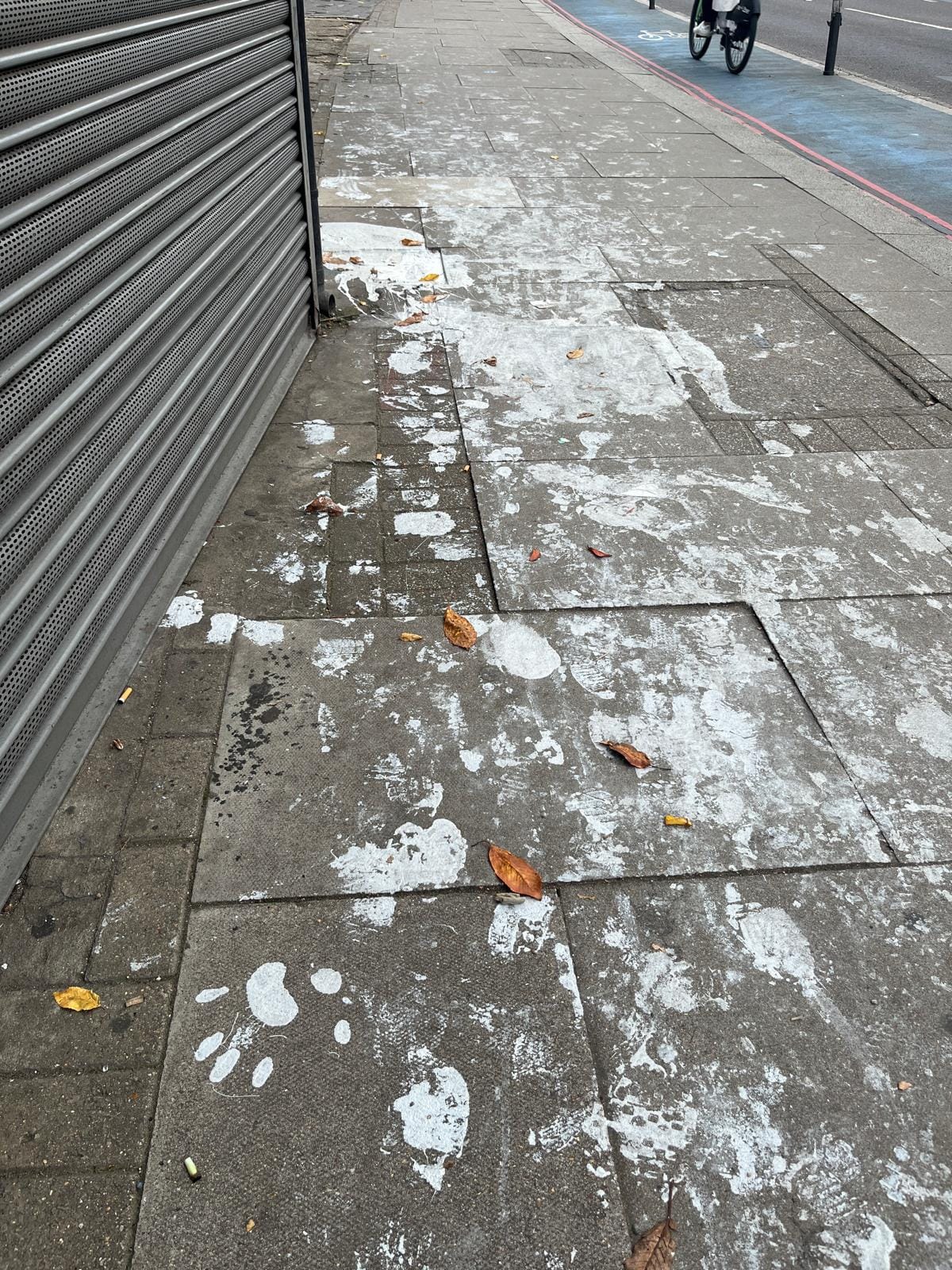 pavement with white hand prints from paint