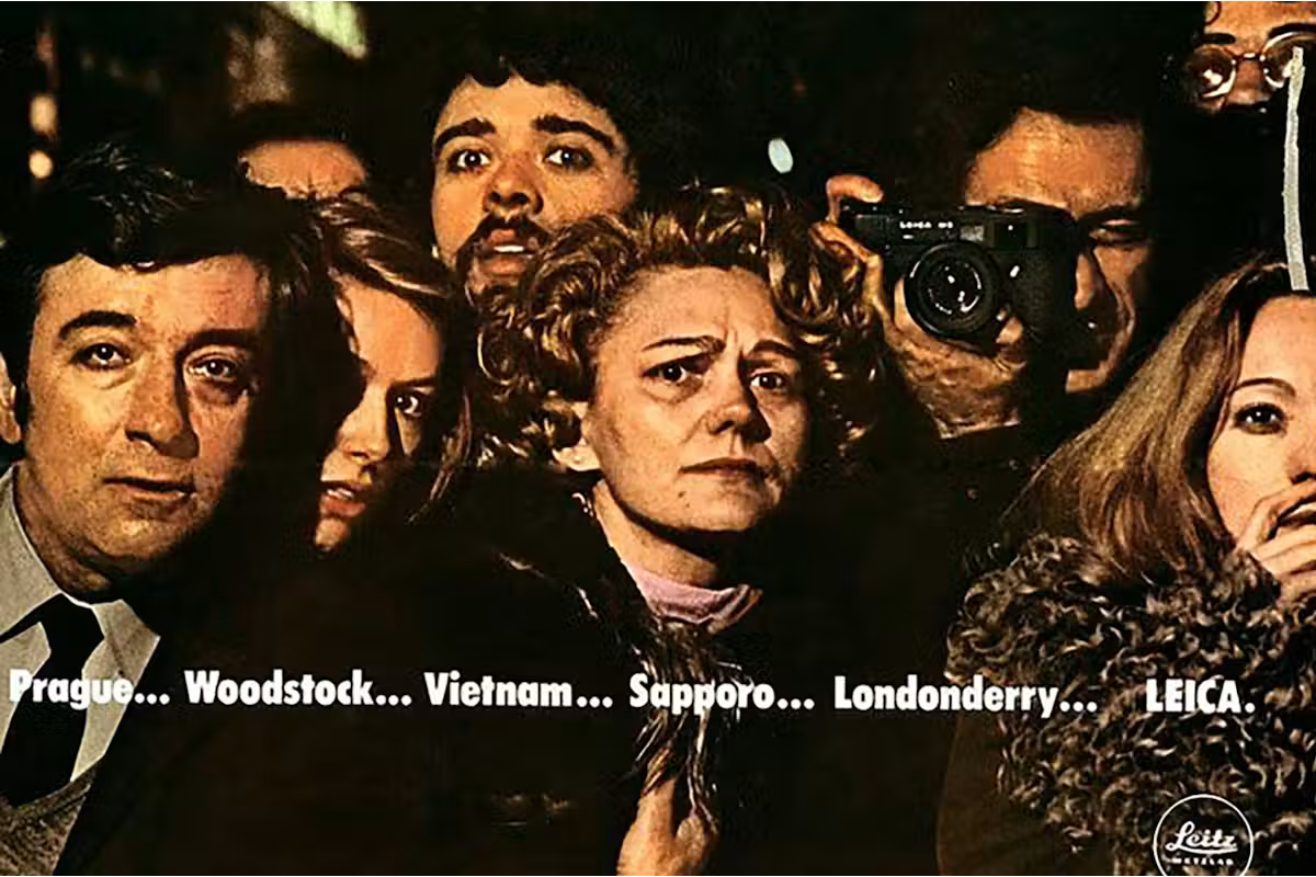 Leica ad in which people are looking fearful and shocked, except the man with the camera.